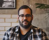 Team member smiling at the camera in an office setting